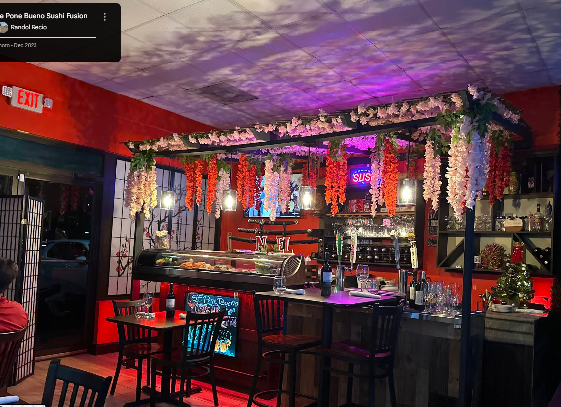 Se Pone Bueno sushi bar interior with red walls and colorful lighting